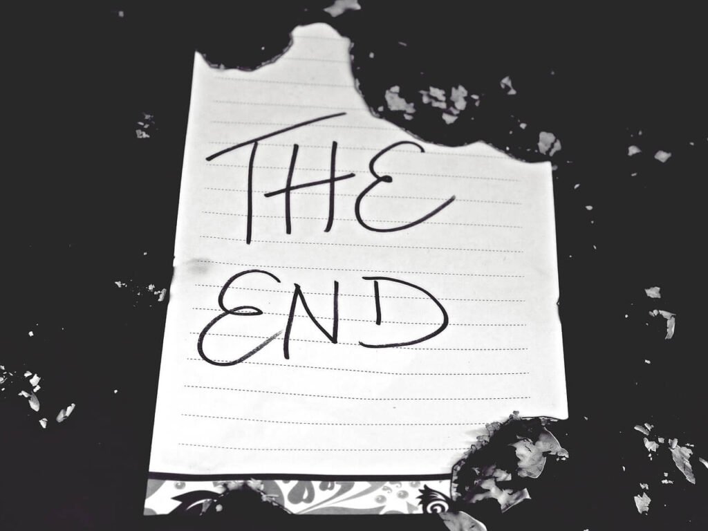 The End on lined paper in black and white.