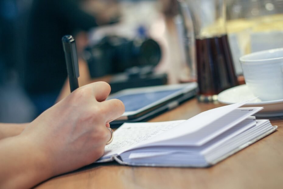 writing_in_notebook_coffee_cup